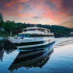 Portland Spirit tour boat for day cruises on the Columbia River shown at sunset