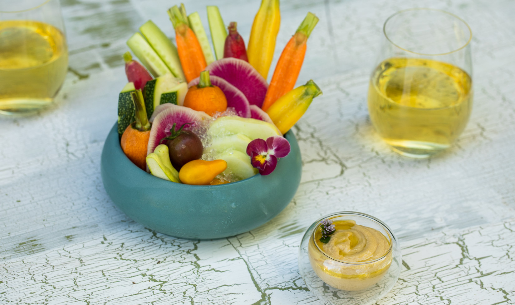 Authentic hummus dip with an assortment of crudite for a centerpiece