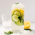 cucumber and lemon water in a pitcher with ice